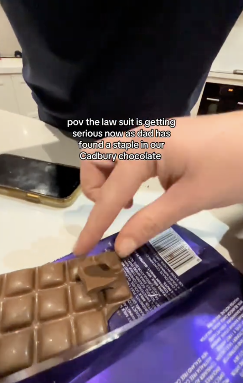 woman holding chocolate bar